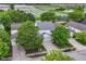Aerial view of a charming home with mature trees and well-manicured landscaping at 15411 Wandering Way, Noblesville, IN 46060