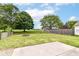 Expansive backyard with a fire pit, mature trees, and a well-maintained lawn at 15411 Wandering Way, Noblesville, IN 46060