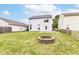 Large backyard with a fire pit and ample green space, perfect for outdoor activities at 15411 Wandering Way, Noblesville, IN 46060