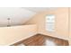 Loft area featuring wood floors and window at 15411 Wandering Way, Noblesville, IN 46060