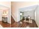 Open floor plan with dining area, staircase and a glimpse of the living room at 15411 Wandering Way, Noblesville, IN 46060