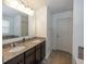 Neutral-toned bathroom with double sink vanity, tile floors and good lighting at 15710 Chapel Park E Dr, Noblesville, IN 46060
