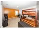 Bedroom with a bunk bed, an orange accent wall, a black computer desk and a window at 15710 Chapel Park E Dr, Noblesville, IN 46060