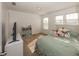 Bright bedroom featuring light-colored walls, a window, and a full sized bed at 15710 Chapel Park E Dr, Noblesville, IN 46060