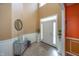 Bright foyer with high ceilings, tiled floors, and elegant decor, showcasing a welcoming entrance at 15710 Chapel Park E Dr, Noblesville, IN 46060
