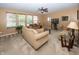 Spacious living room with neutral tones, large windows, and comfortable seating, perfect for relaxation at 15710 Chapel Park E Dr, Noblesville, IN 46060
