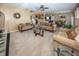Bright and airy living room showcasing multiple seating areas and seamless flow to the dining area at 15710 Chapel Park E Dr, Noblesville, IN 46060