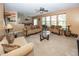 Spacious living room with comfortable seating and an open layout connecting to the dining area at 15710 Chapel Park E Dr, Noblesville, IN 46060
