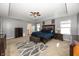 Main bedroom boasts a tray ceiling, furnishings, and windows for natural light at 15710 Chapel Park E Dr, Noblesville, IN 46060