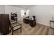 Home office with neutral carpet, a desk with an office chair, and a pair of guest chairs at 15710 Chapel Park E Dr, Noblesville, IN 46060