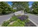 Community entrance to Chapel Woods of Noblesville with lush landscaping and beautiful signage along a tree lined street at 15710 Chapel Park E Dr, Noblesville, IN 46060