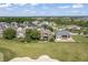 Wide aerial view of golf course community featuring well-manicured lawns and beautiful homes at 16502 Grand Cypress Dr, Noblesville, IN 46060