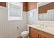 Charming half bathroom with white wainscoting, neutral vanity, and plenty of natural light at 16502 Grand Cypress Dr, Noblesville, IN 46060