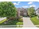 Beautiful brick home boasts mature landscaping and a spacious driveway at 16502 Grand Cypress Dr, Noblesville, IN 46060
