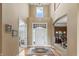 Elegant foyer with high ceilings, hardwood floors, and a bright entryway at 16502 Grand Cypress Dr, Noblesville, IN 46060