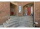 Charming front entrance featuring brick architecture and curved steps at 16502 Grand Cypress Dr, Noblesville, IN 46060