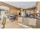 Beautiful kitchen with stainless steel appliances, breakfast bar, and hardwood floors at 16502 Grand Cypress Dr, Noblesville, IN 46060