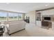 Spacious living room with built-in desk, cabinetry, and a large window showcasing the golf course at 16502 Grand Cypress Dr, Noblesville, IN 46060