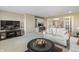 Living room featuring a built-in desk, cabinets, and a flat screen television at 16502 Grand Cypress Dr, Noblesville, IN 46060