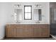 Elegant bathroom featuring a double vanity, modern fixtures, and stylish mirrors at 1664 Carrollton Rail Dr, Westfield, IN 46074