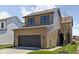 Two-story home with brown siding, dark windows, a dark garage door and a well-kept lawn at 1664 Carrollton Rail Dr, Westfield, IN 46074
