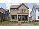 Charming two-story home featuring a second story balcony and professional landscaping at 1664 Carrollton Rail Dr, Westfield, IN 46074