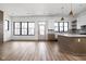 Open-concept kitchen and living area with modern appliances, stylish cabinetry, and ample natural light at 1664 Carrollton Rail Dr, Westfield, IN 46074