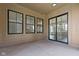 Covered patio boasts black frame windows and sliding glass doors offering seamless indoor-outdoor living at 1664 Carrollton Rail Dr, Westfield, IN 46074