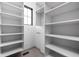 Walk-in closet features custom shelving, a window for natural light, and ample storage space for an organized wardrobe at 1664 Carrollton Rail Dr, Westfield, IN 46074