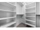 This expansive walk-in closet boasts built-in shelving and multiple rods for hanging, providing optimal organization at 1664 Carrollton Rail Dr, Westfield, IN 46074