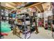 This basement offers unfinished storage space with exposed ceiling and organized shelving and storage containers at 1664 Woodside Cir, Franklin, IN 46131