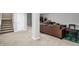 Partially finished basement with carpeted floors and a sturdy support beam at 1664 Woodside Cir, Franklin, IN 46131