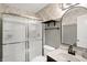 Bathroom with glass enclosed shower, tile backsplash, and modern fixtures at 1664 Woodside Cir, Franklin, IN 46131