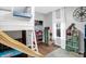 A playful bedroom featuring a unique lofted bed with a slide, ample storage, and a fun atmosphere at 1664 Woodside Cir, Franklin, IN 46131