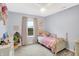room with a window and a light blue paint at 1664 Woodside Cir, Franklin, IN 46131