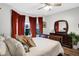 This charming bedroom boasts a queen bed, an elegant dresser, and plenty of natural light from the bay window at 1664 Woodside Cir, Franklin, IN 46131