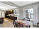 Open concept dining room features hardwood floors, backyard view, and a view into the kitchen at 1664 Woodside Cir, Franklin, IN 46131