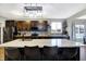 Modern kitchen with a spacious island and dark cabinetry at 1664 Woodside Cir, Franklin, IN 46131