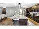 Kitchen featuring a large island, dark cabinetry, and stainless steel appliances at 1664 Woodside Cir, Franklin, IN 46131