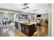 Open concept kitchen with large island, stainless appliances, and hardwood floors at 1664 Woodside Cir, Franklin, IN 46131