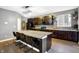 Kitchen with a large island with bar seating, modern pendant lighting, and stainless steel appliances at 1664 Woodside Cir, Franklin, IN 46131