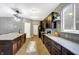 Modern kitchen with dark cabinetry, large island, and stainless steel appliances at 1664 Woodside Cir, Franklin, IN 46131