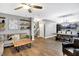 Inviting living room features hardwood floors, a modern ceiling fan, and floating shelves at 1664 Woodside Cir, Franklin, IN 46131