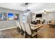 Open-concept living and dining area with fireplace and large windows at 1664 Woodside Cir, Franklin, IN 46131