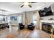 Spacious living room with a fireplace, hardwood floors, natural light, and open concept layout at 1664 Woodside Cir, Franklin, IN 46131