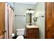 Bathroom showcasing a granite-look vanity, a mirror with decorative lighting, and neutral walls at 18906 Crestview Ct, Westfield, IN 46074