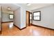Bright bedroom with light wood floors, an open closet, trim detail and natural light from the window at 18906 Crestview Ct, Westfield, IN 46074