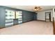 Spacious bedroom with blue walls, plush carpet, large window, and a ceiling fan at 18906 Crestview Ct, Westfield, IN 46074