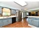 Cozy kitchen featuring blue cabinets, stainless steel appliances, and an island at 18906 Crestview Ct, Westfield, IN 46074