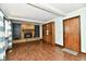 Cozy living room featuring a stone fireplace, hardwood floors, built-in shelves, and beamed ceilings at 18906 Crestview Ct, Westfield, IN 46074